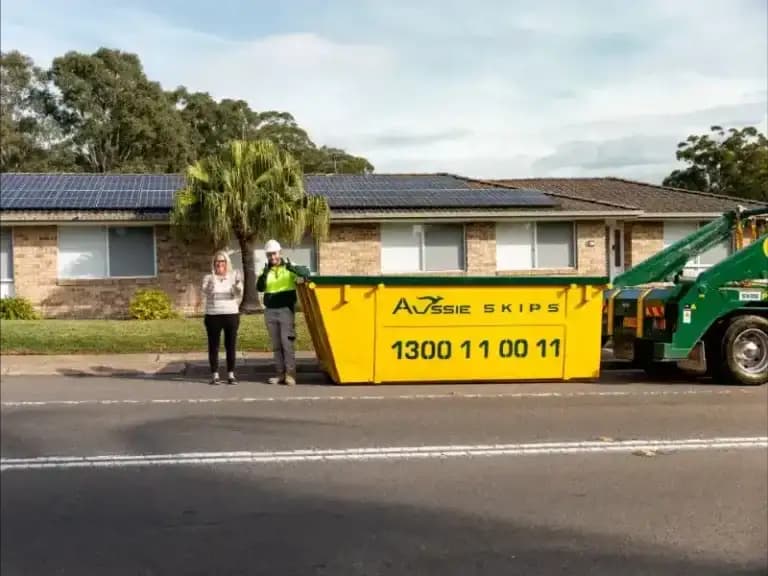Aussie Skips truck and skip bin outside a Sydney home
