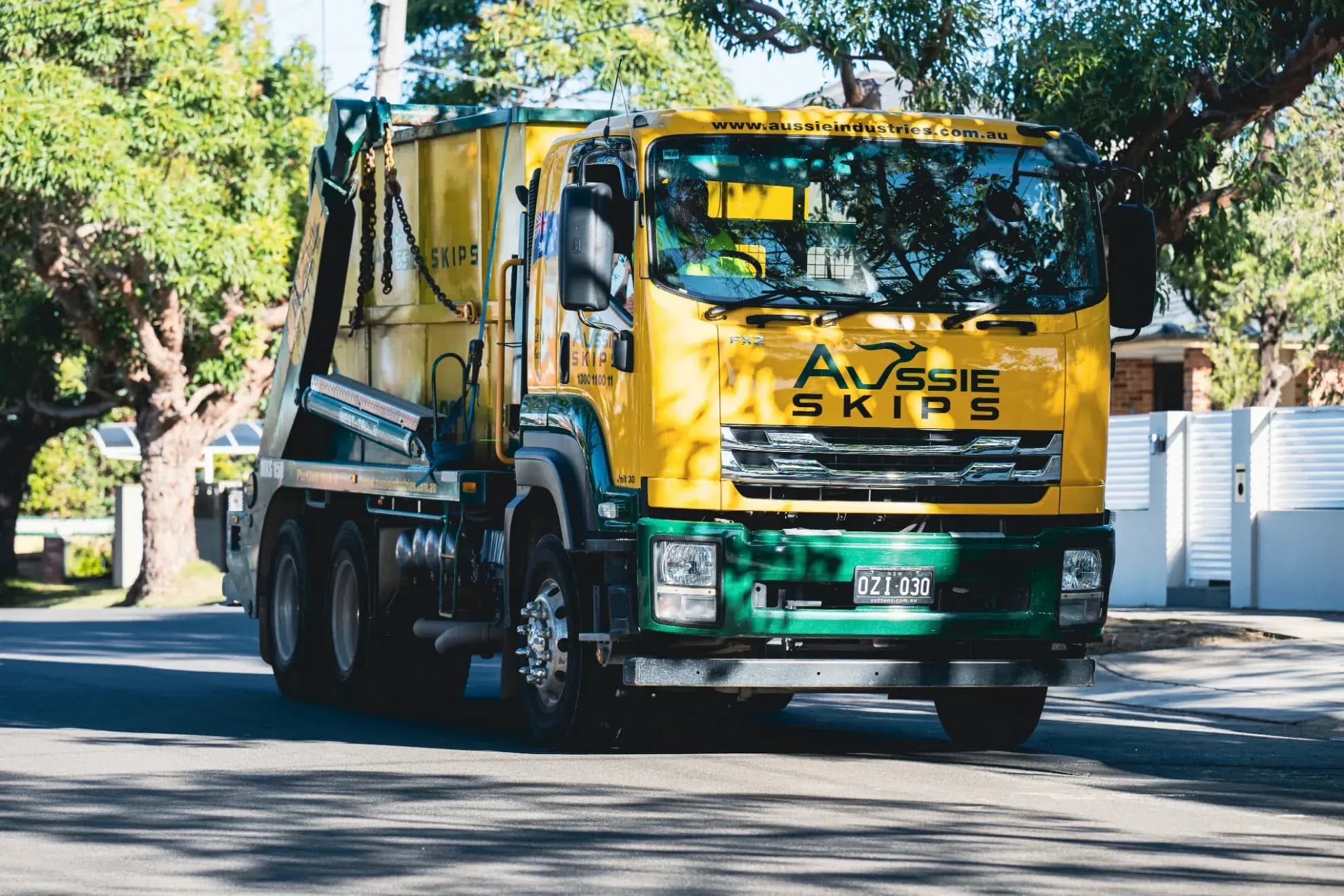 Aussie Skip bin truck with hired bin on back of it